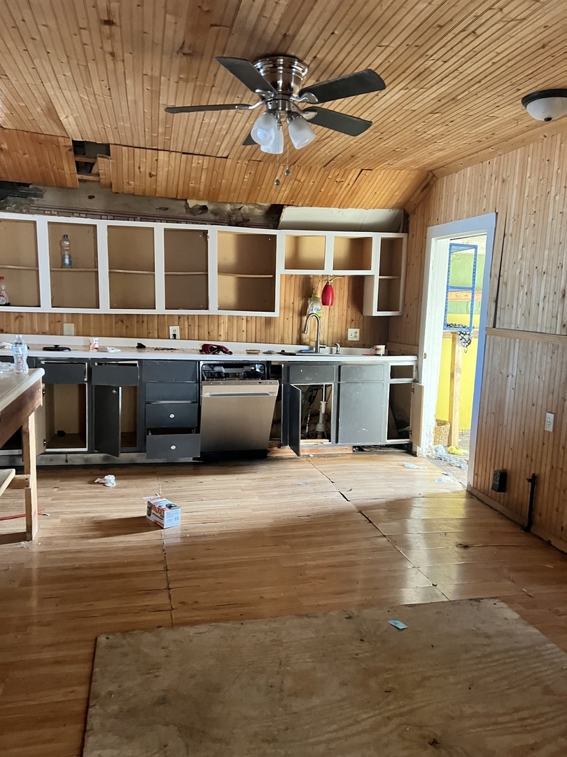 207 Grove Street Rankin, IL 60960 - Photo 4 of 9 a large kitchen with stainless steel appliances granite countertop a sink and a stove