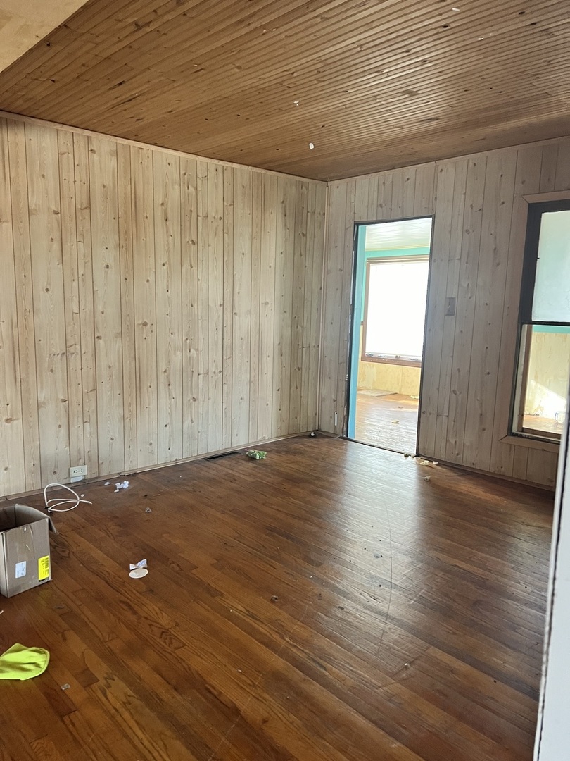 207 Grove Street Rankin, IL 60960 - Photo 7 of 9 a view of a room with wooden floor and window