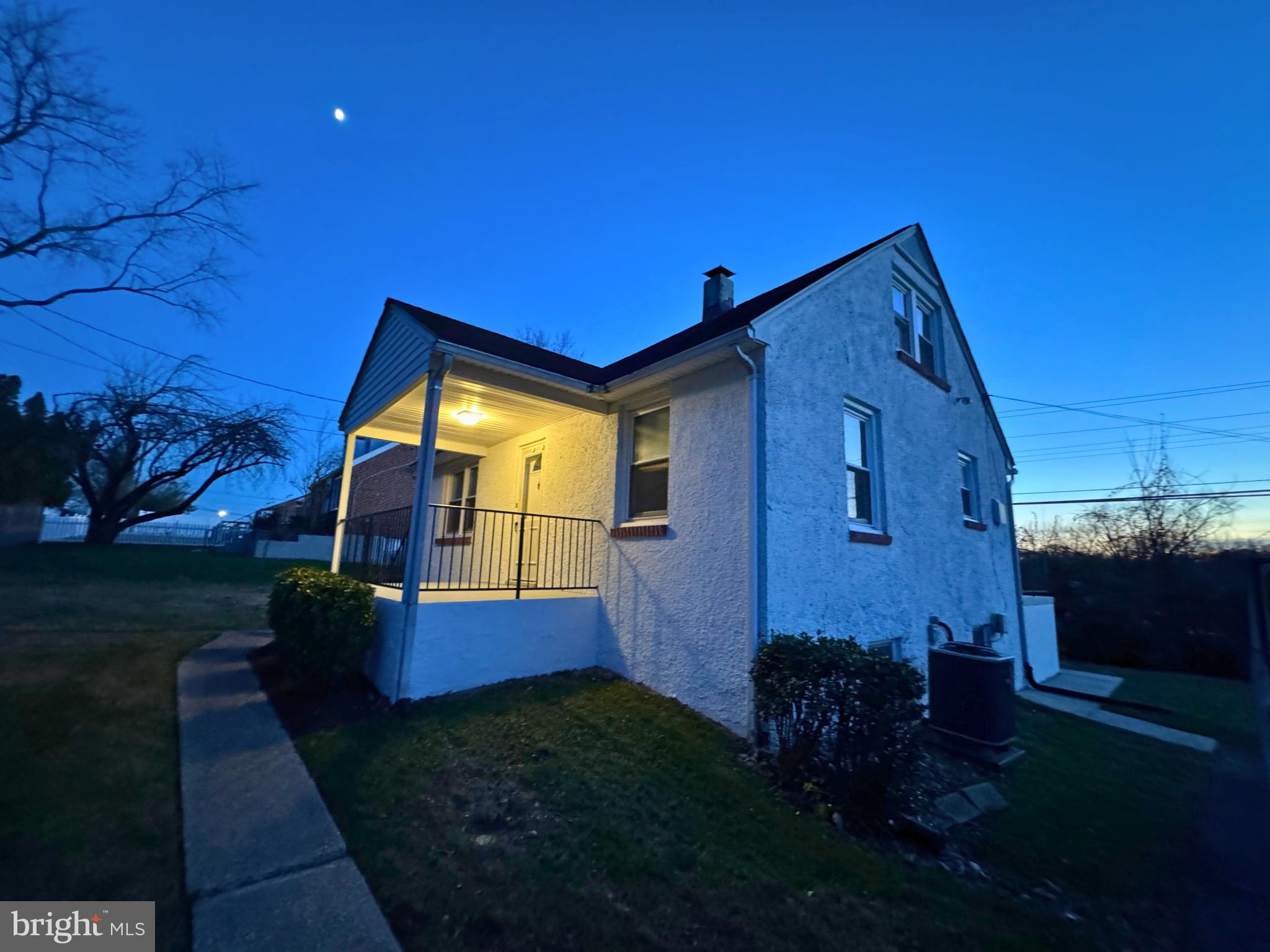 2909 Duncan Lane Parkville, MD 21234 - Photo 20 of 20 a view of a house with brick walls and a yard with plants