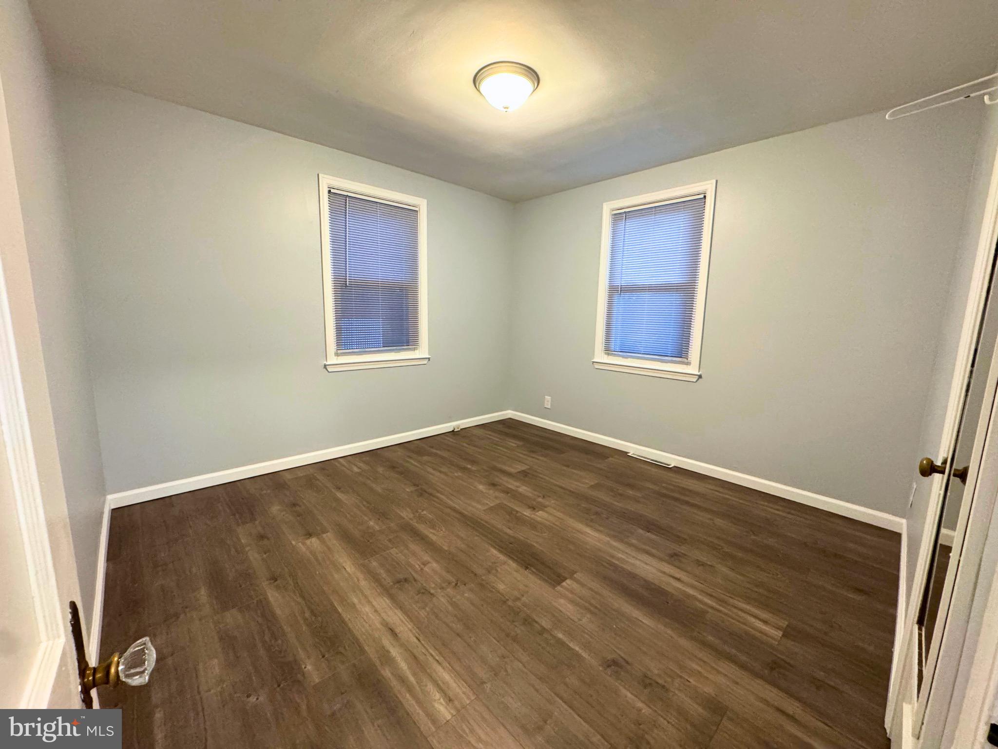 2909 Duncan Lane Parkville, MD 21234 - Photo 10 of 20 a view of empty room with wooden floor