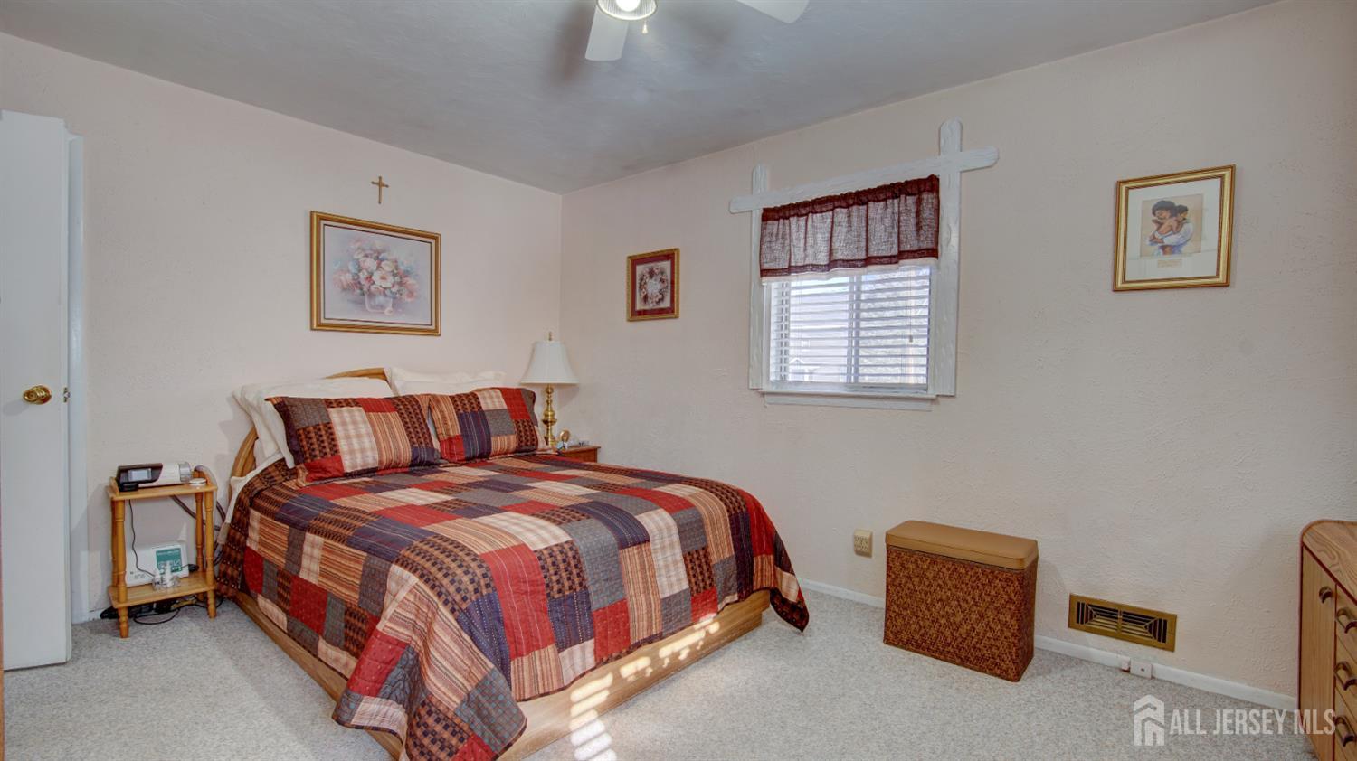 159 Newbury Road Howell, NJ 07731 - Photo 15 of 28 a bedroom with a bed and a lamp on dresser