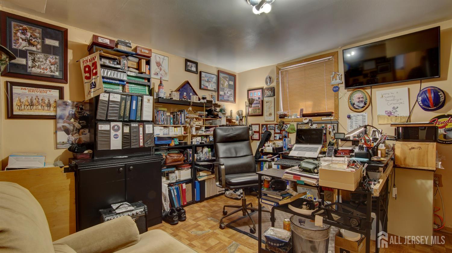 159 Newbury Road Howell, NJ 07731 - Photo 23 of 28 a living room with lots of furniture and a flat screen tv