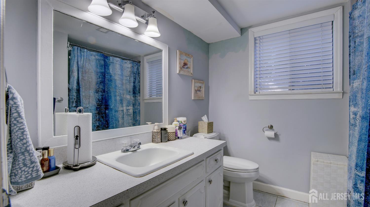 159 Newbury Road Howell, NJ 07731 - Photo 24 of 28 a bathroom with a sink vanity mirror and toilet