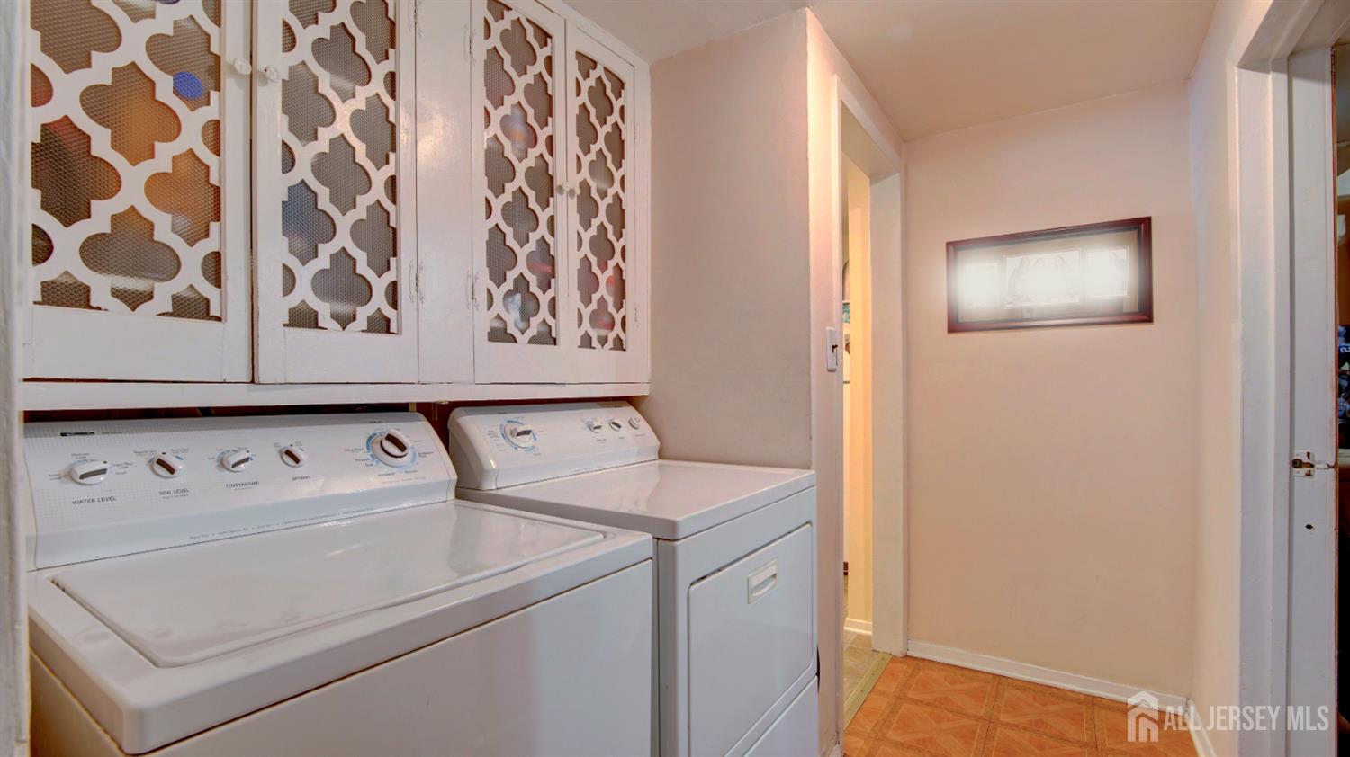159 Newbury Road Howell, NJ 07731 - Photo 25 of 28 a utility room with dryer and washer