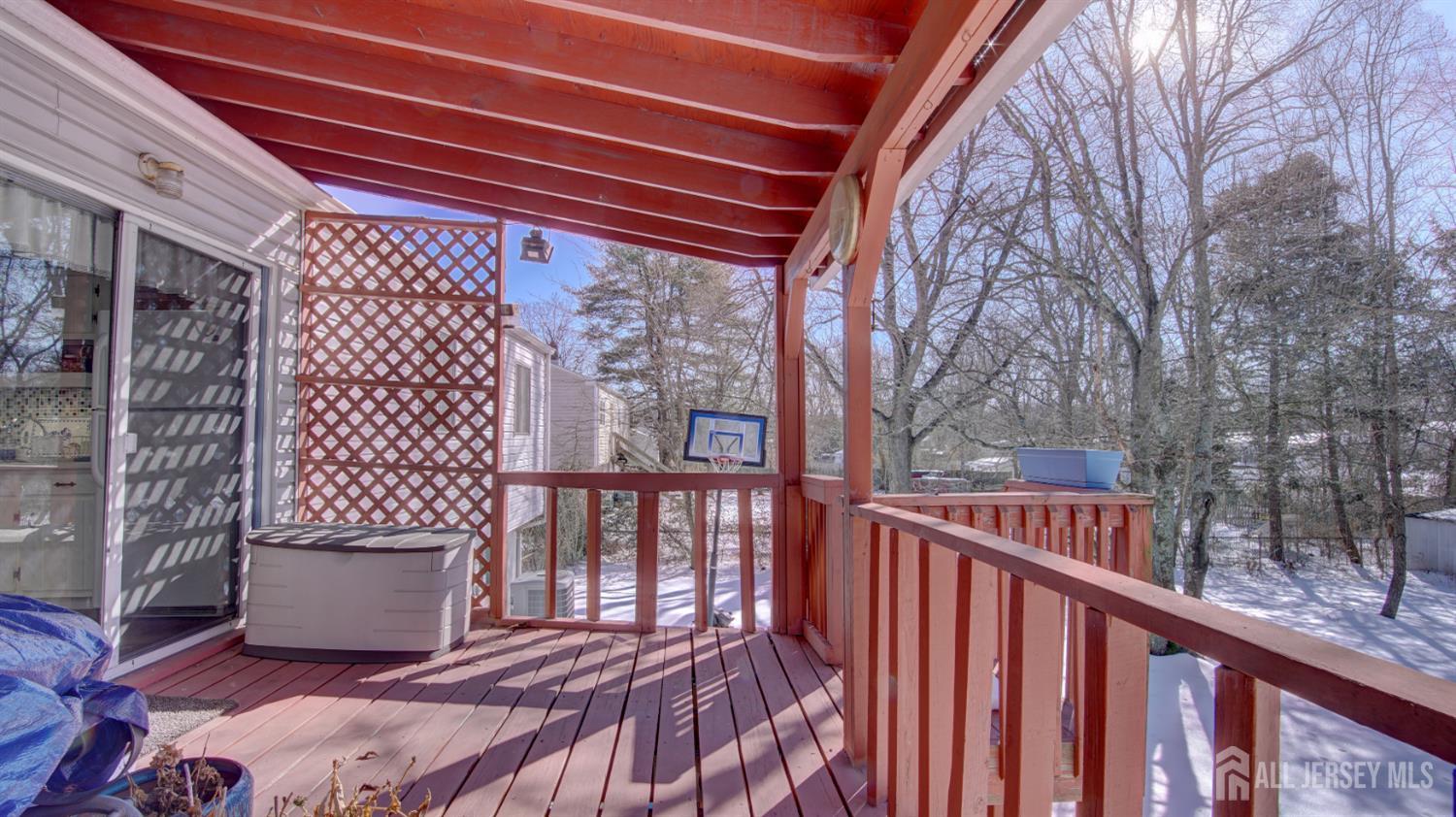 159 Newbury Road Howell, NJ 07731 - Photo 27 of 28 a view of a wooden door with a bench