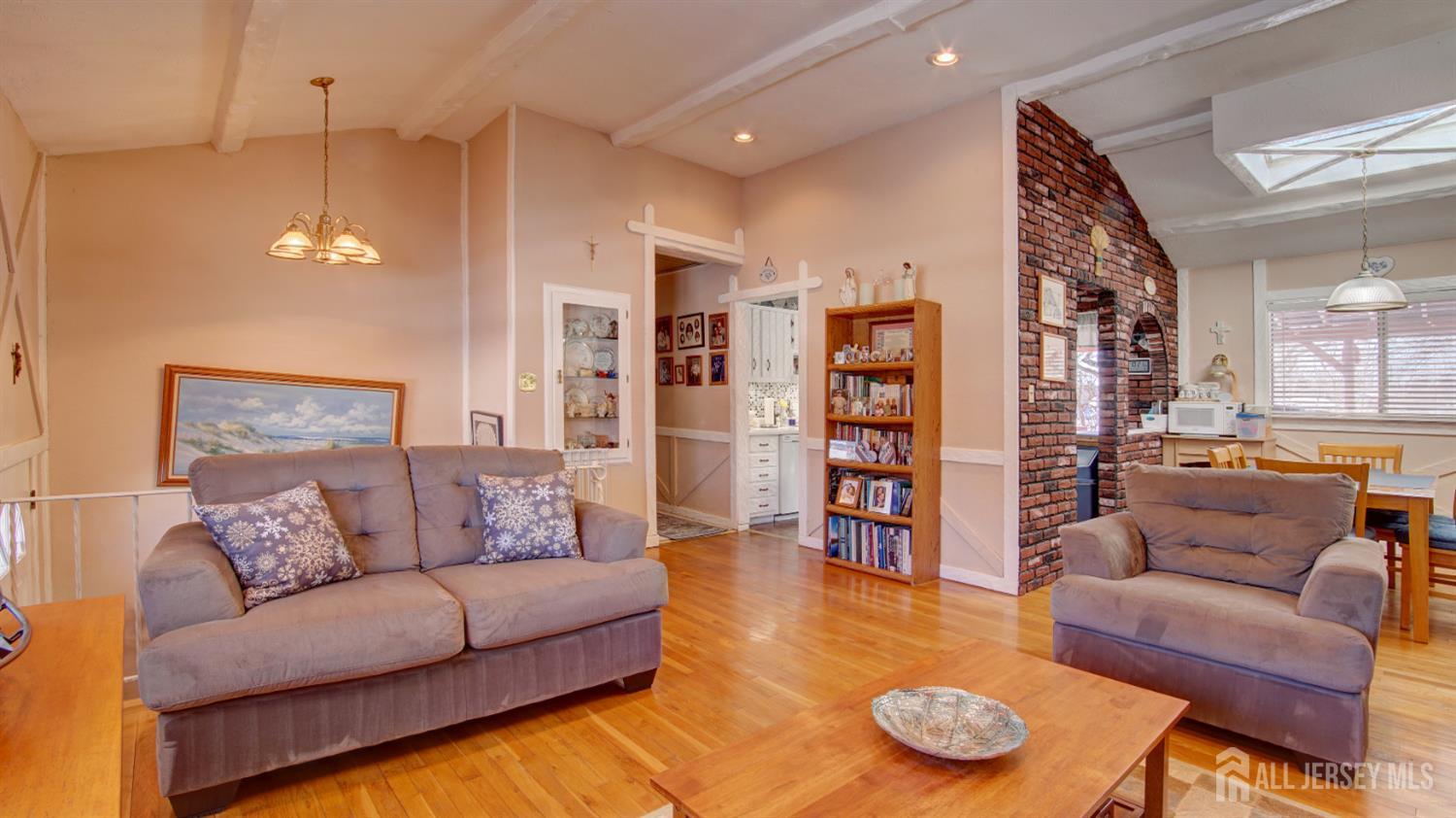 159 Newbury Road Howell, NJ 07731 - Photo 5 of 28 a living room with furniture and a wooden floor