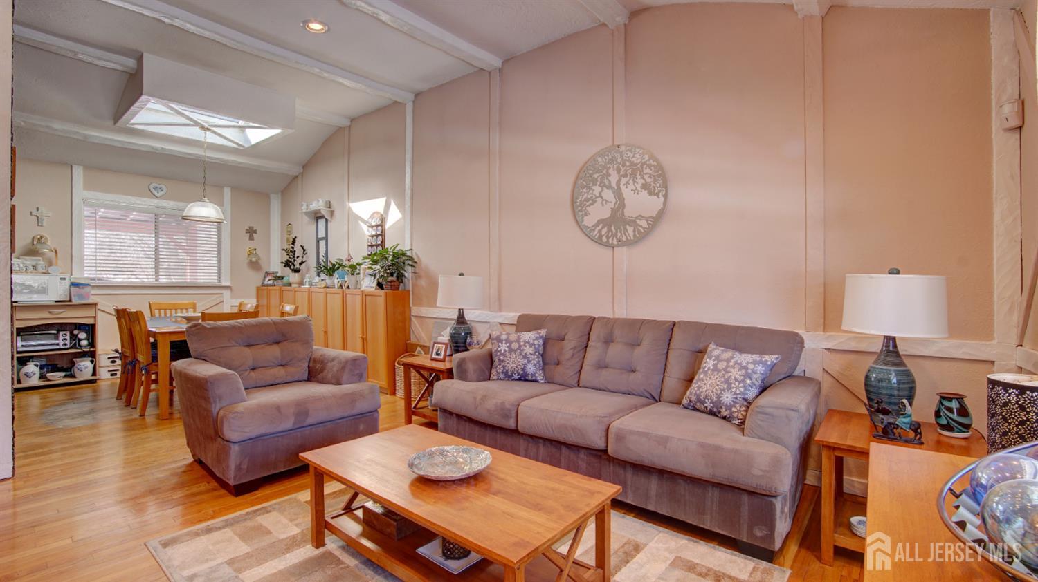159 Newbury Road Howell, NJ 07731 - Photo 6 of 28 a living room with furniture a rug and a lamp