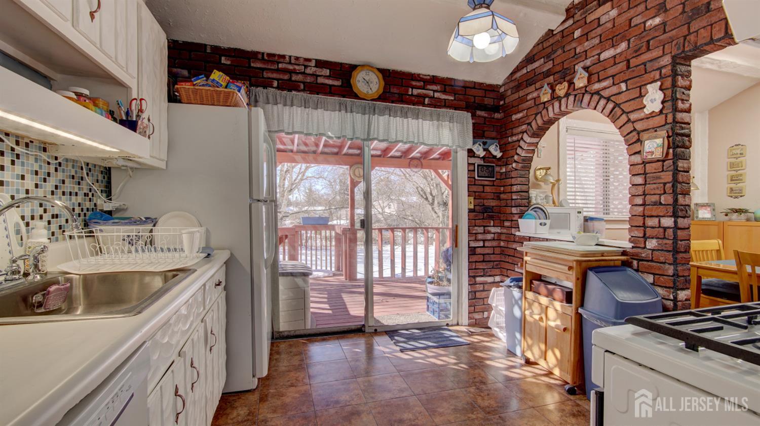 159 Newbury Road Howell, NJ 07731 - Photo 9 of 28 a kitchen with sink cabinets and stove