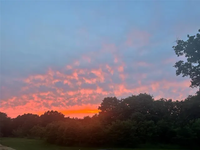 a view of lake with green space