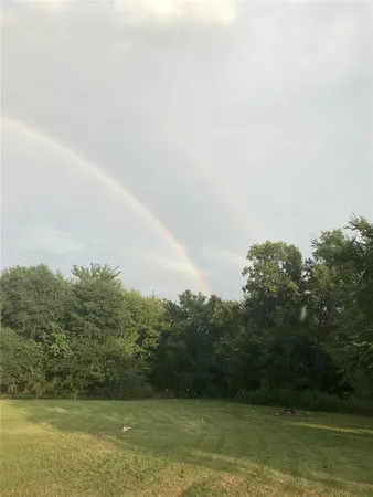 a view of a yard with a lake view