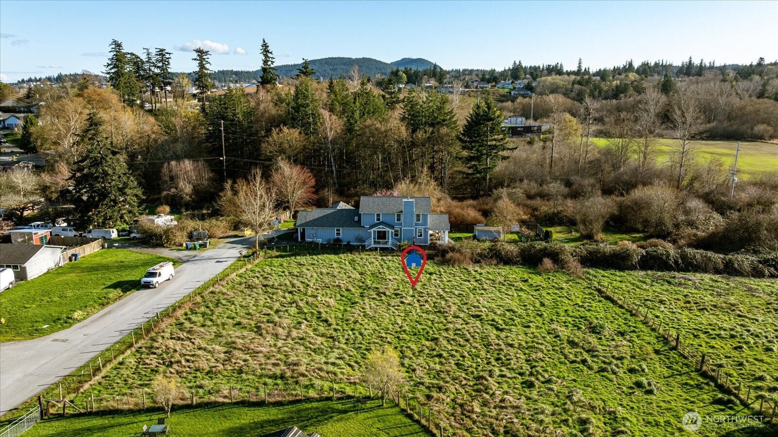 0 I Avenue Anacortes, WA 98221 - Photo 8 of 19 aerial view of a house with a yard basket ball court and outdoor seating