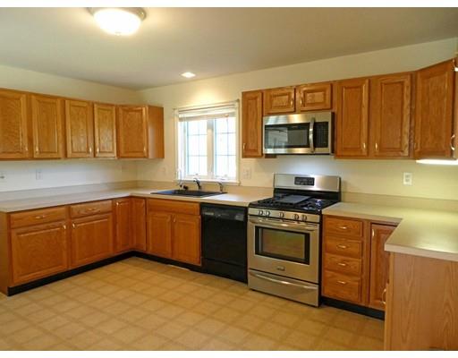 261 Cushman Road Rochester, MA 02770 - Photo 11 of 25 a kitchen with stainless steel appliances granite countertop a stove a sink and a microwave