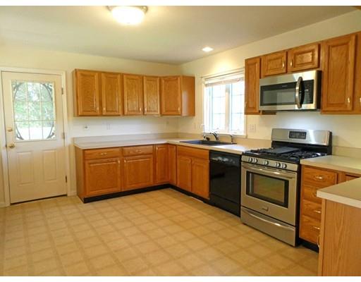 261 Cushman Road Rochester, MA 02770 - Photo 12 of 25 a kitchen with stainless steel appliances granite countertop a stove a sink dishwasher a refrigerator and a microwave