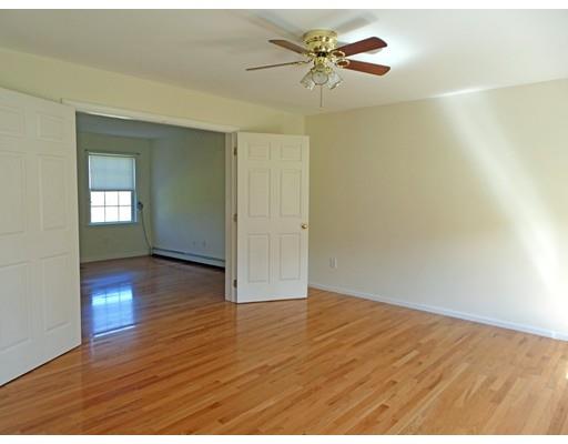 261 Cushman Road Rochester, MA 02770 - Photo 16 of 25 an empty room with wooden floor and windows