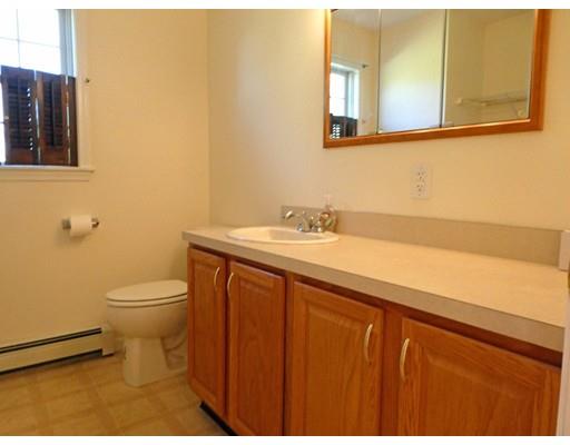 261 Cushman Road Rochester, MA 02770 - Photo 19 of 25 a bathroom with a sink a toilet and mirror
