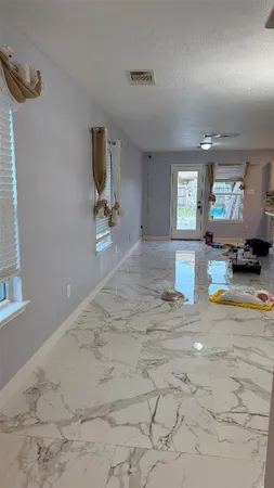 a view of a living room and kitchen