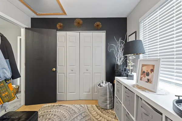 a bedroom with a bed and a cabinets