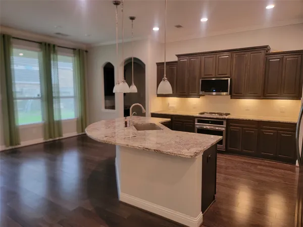 a view of kitchen with cabinets and stainless steel appliances