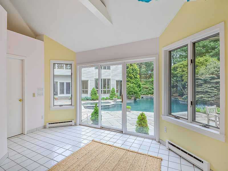 31 Point Road Norwalk, CT 06854 - Photo 17 of 19 a view of empty room with wooden floor and floor to ceiling window