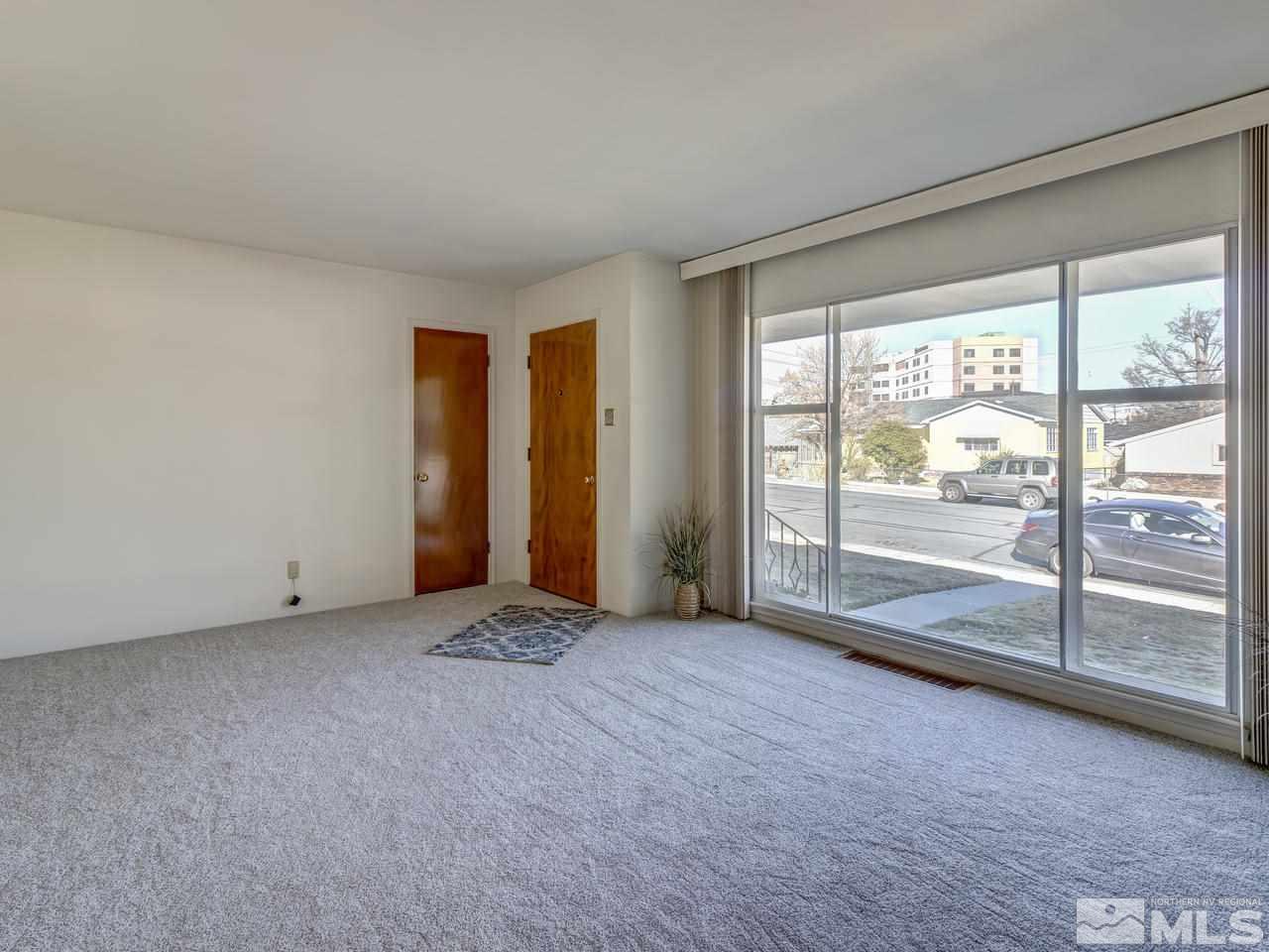 751 Balzar Circle Reno, NV 89502 - Photo 3 of 25 a view of an empty room with glass door