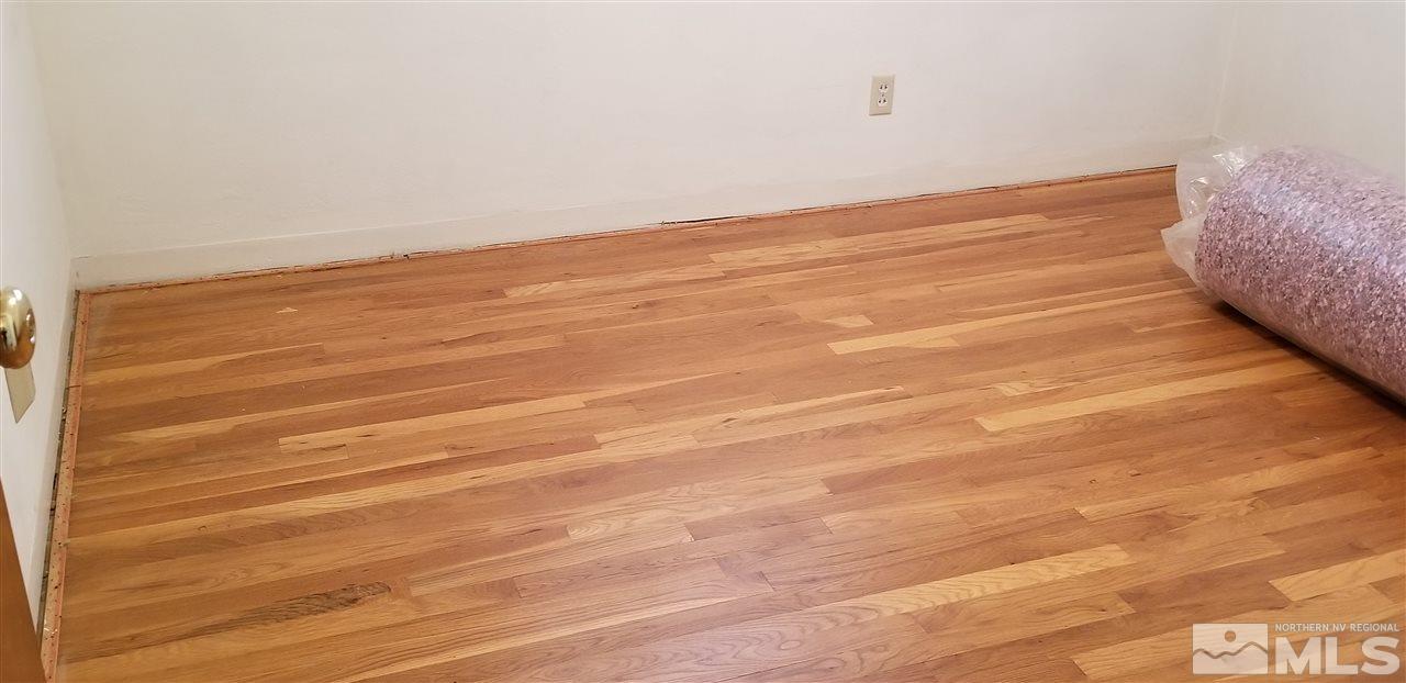 751 Balzar Circle Reno, NV 89502 - Photo 4 of 25 a view of a room with an empty space and wooden floor