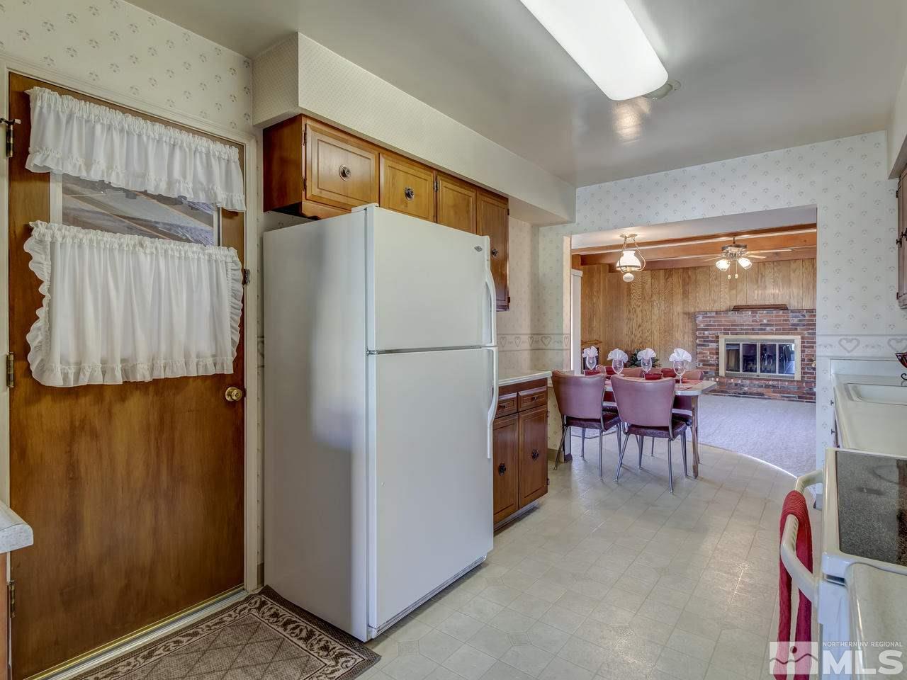 751 Balzar Circle Reno, NV 89502 - Photo 8 of 25 a refrigerator freezer sitting inside of a kitchen