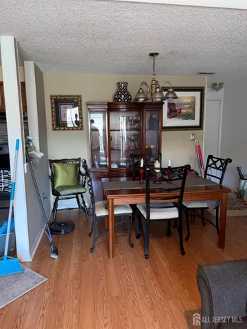 a living room with furniture wooden floor and a flat screen tv