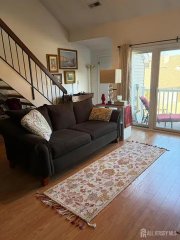 a living room with furniture and a rug