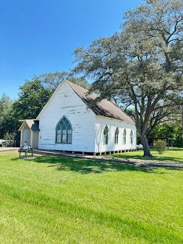 a house with swimming pool in front of it