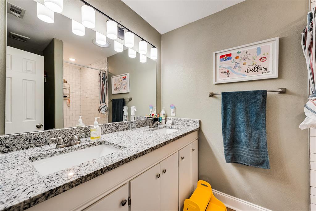 2522 Millmar Drive Dallas, TX 75228 - Photo 19 of 27 a bathroom with a granite countertop vanity a sink and a mirror