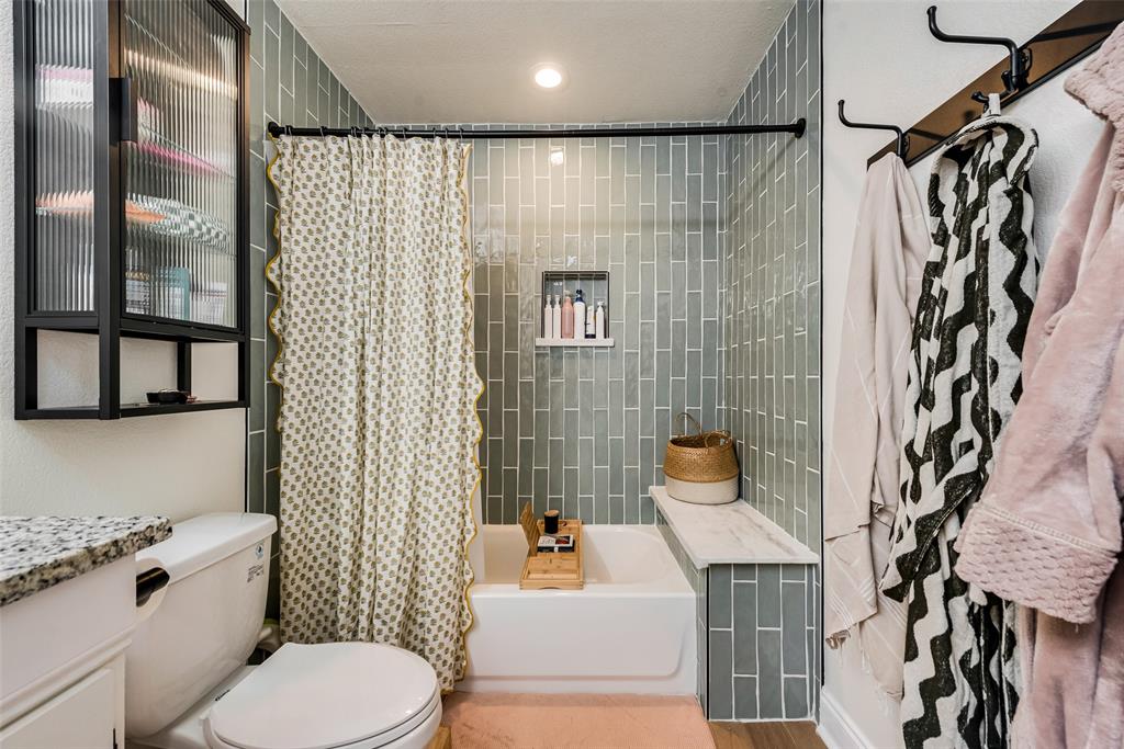 2522 Millmar Drive Dallas, TX 75228 - Photo 24 of 27 a bathroom with a sink toilet and shower