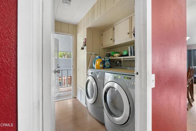 a view of storage and utility room with washer and dryer
