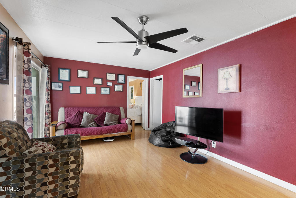 265 Beckwith Road, Unit 57 Santa Paula, CA 93060 - Photo 12 of 22 a bedroom with bed and a flat screen tv