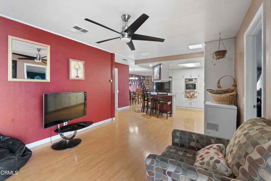 265 Beckwith Road, Unit 57 Santa Paula, CA 93060 - Photo 13 of 22 a living room with furniture and a flat screen tv