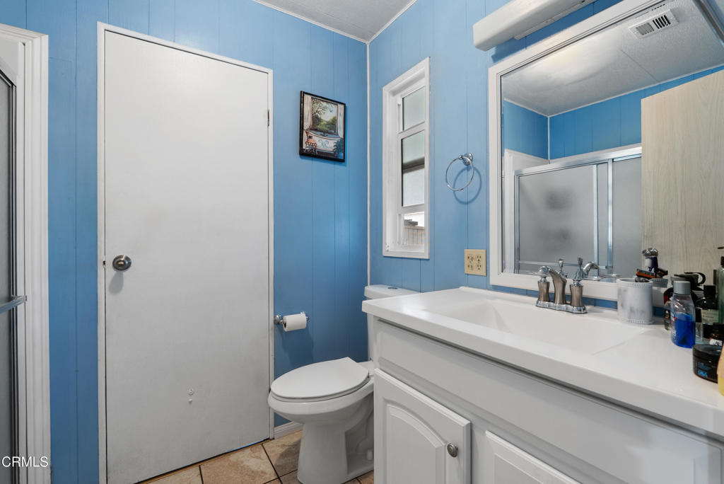 265 Beckwith Road, Unit 57 Santa Paula, CA 93060 - Photo 16 of 22 a bathroom with a sink a toilet and shower