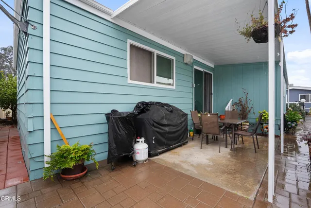 a outdoor living space with furniture and a potted plant