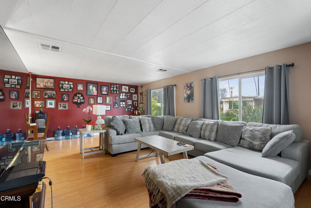 265 Beckwith Road, Unit 57 Santa Paula, CA 93060 - Photo 5 of 22 a living room with furniture and a large window