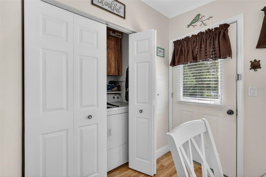 469 Santa Fe Road Tavares, FL 32778 - Photo 17 of 37 a view of a closet area with wooden floor