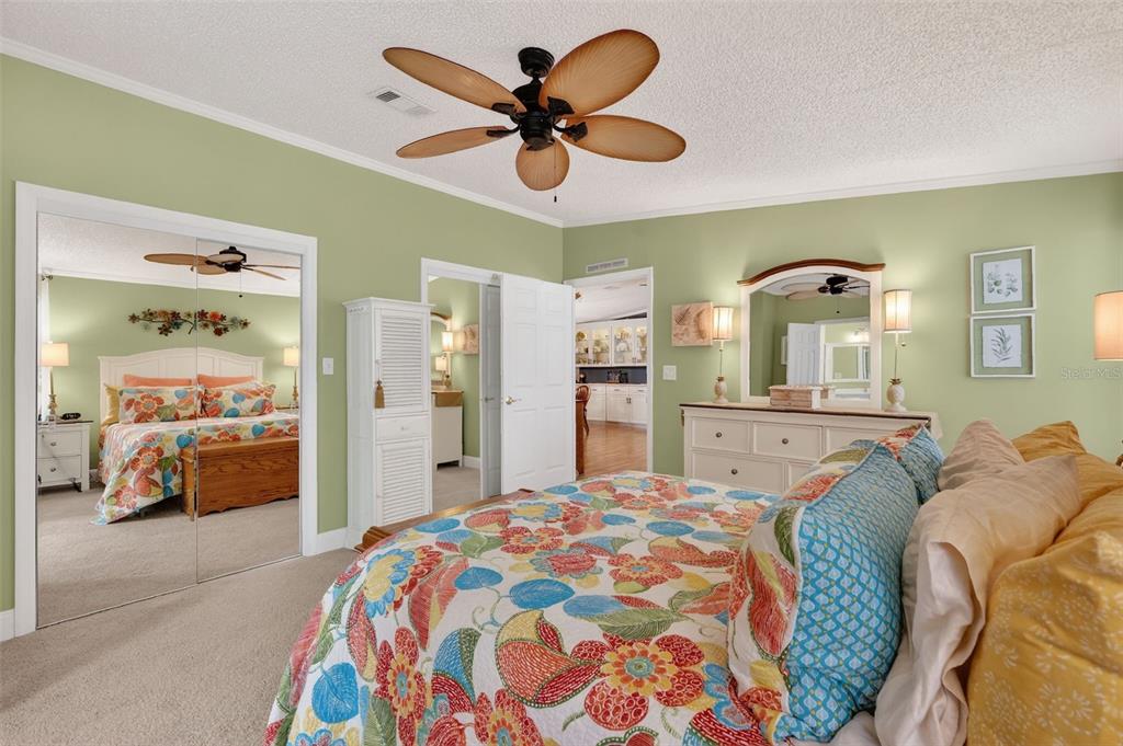 469 Santa Fe Road Tavares, FL 32778 - Photo 19 of 37 a bedroom with a bed and ceiling fan