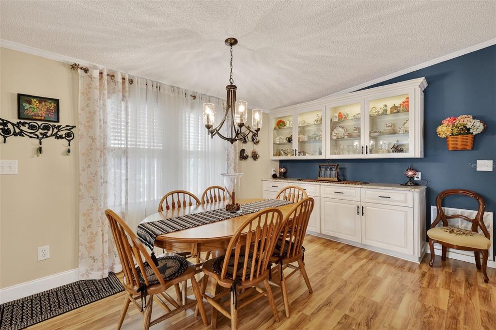 469 Santa Fe Road Tavares, FL 32778 - Photo 5 of 37 a view of a dining room with furniture window and wooden floor