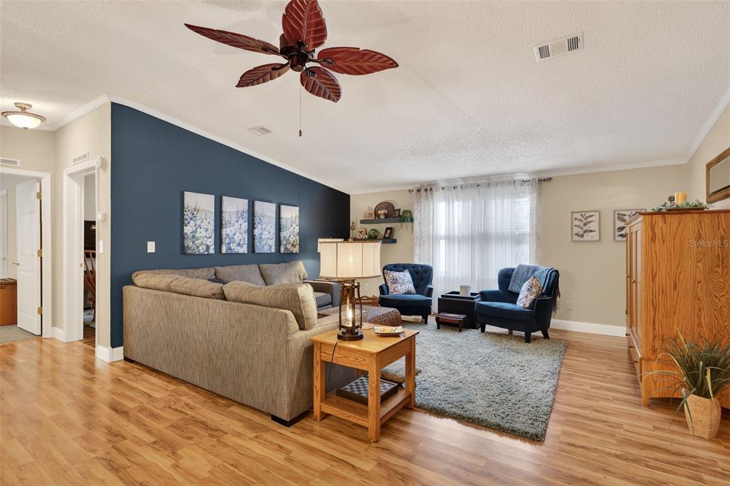 469 Santa Fe Road Tavares, FL 32778 - Photo 7 of 37 a living room with furniture and a wooden floor