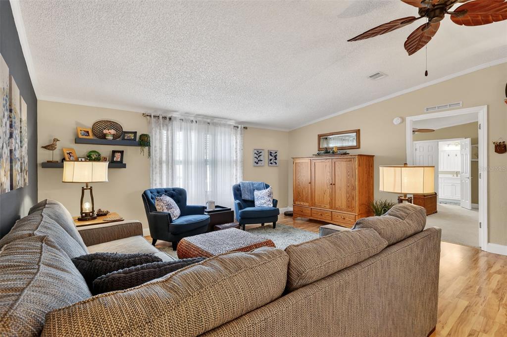 469 Santa Fe Road Tavares, FL 32778 - Photo 8 of 37 a living room with furniture and a couch