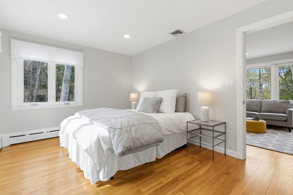 31 Huckleberry Hill Road Lincoln, MA 01773 - Photo 17 of 27 a bedroom with a bed and wooden floor