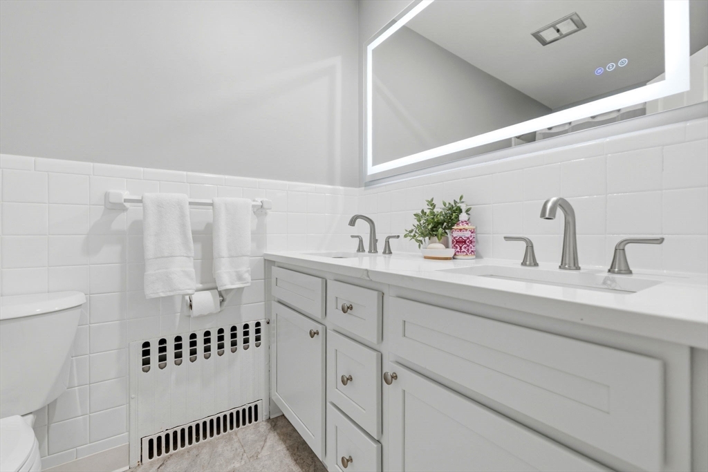 31 Huckleberry Hill Road Lincoln, MA 01773 - Photo 21 of 27 a bathroom with a sink and a mirror