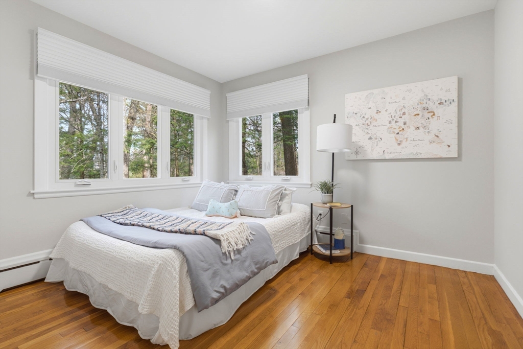 31 Huckleberry Hill Road Lincoln, MA 01773 - Photo 22 of 27 a bedroom with a bed and a large window