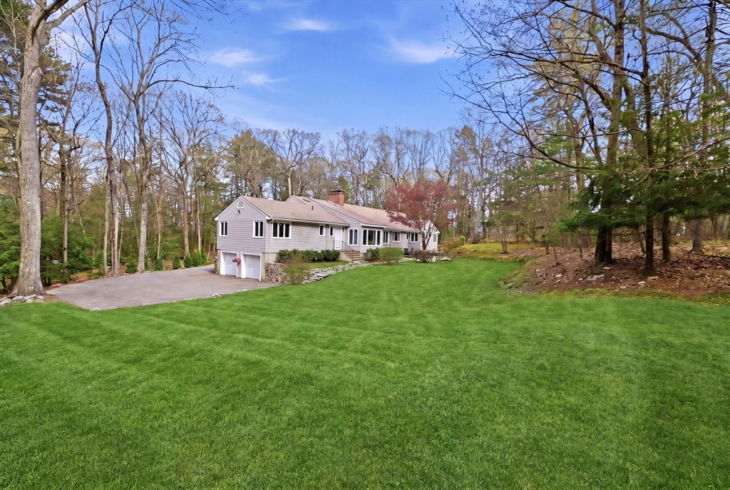 31 Huckleberry Hill Road Lincoln, MA 01773 - Photo 26 of 27 a view of a house with a yard