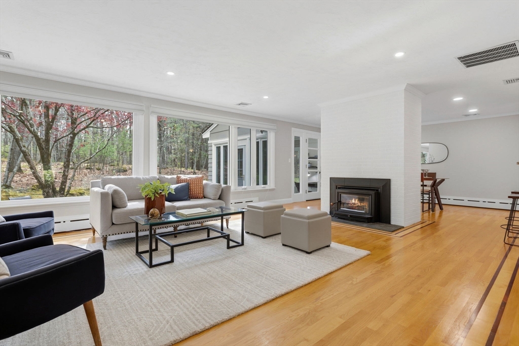 31 Huckleberry Hill Road Lincoln, MA 01773 - Photo 3 of 27 a living room with furniture and a fireplace