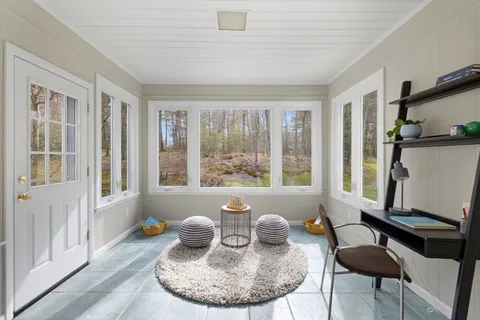a view of a dining room with furniture window and outside view