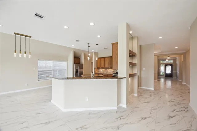 a kitchen with stainless steel appliances a refrigerator and a sink