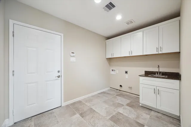 a view of a kitchen with electric appliances